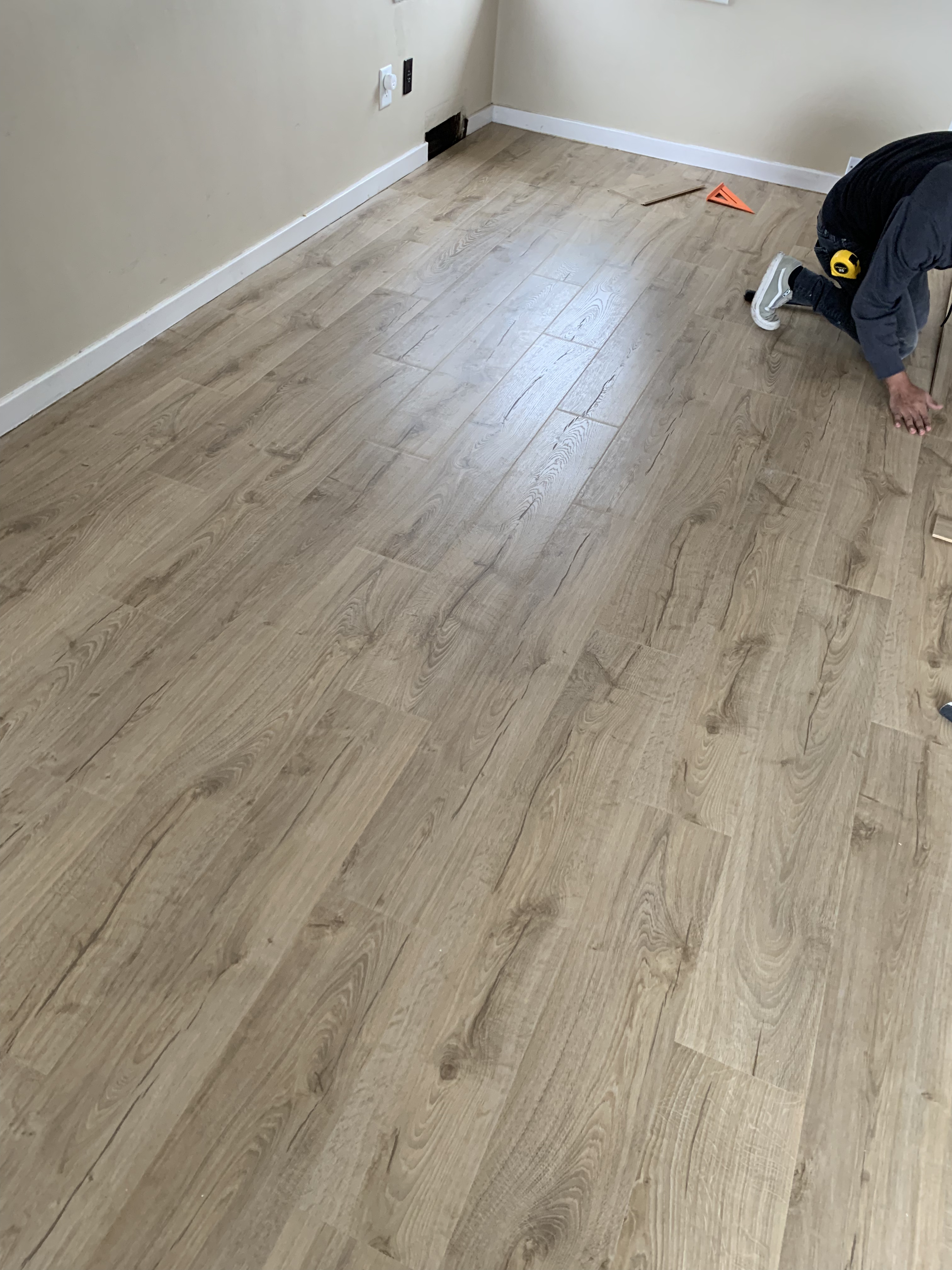 Laminate flooring installation in progress